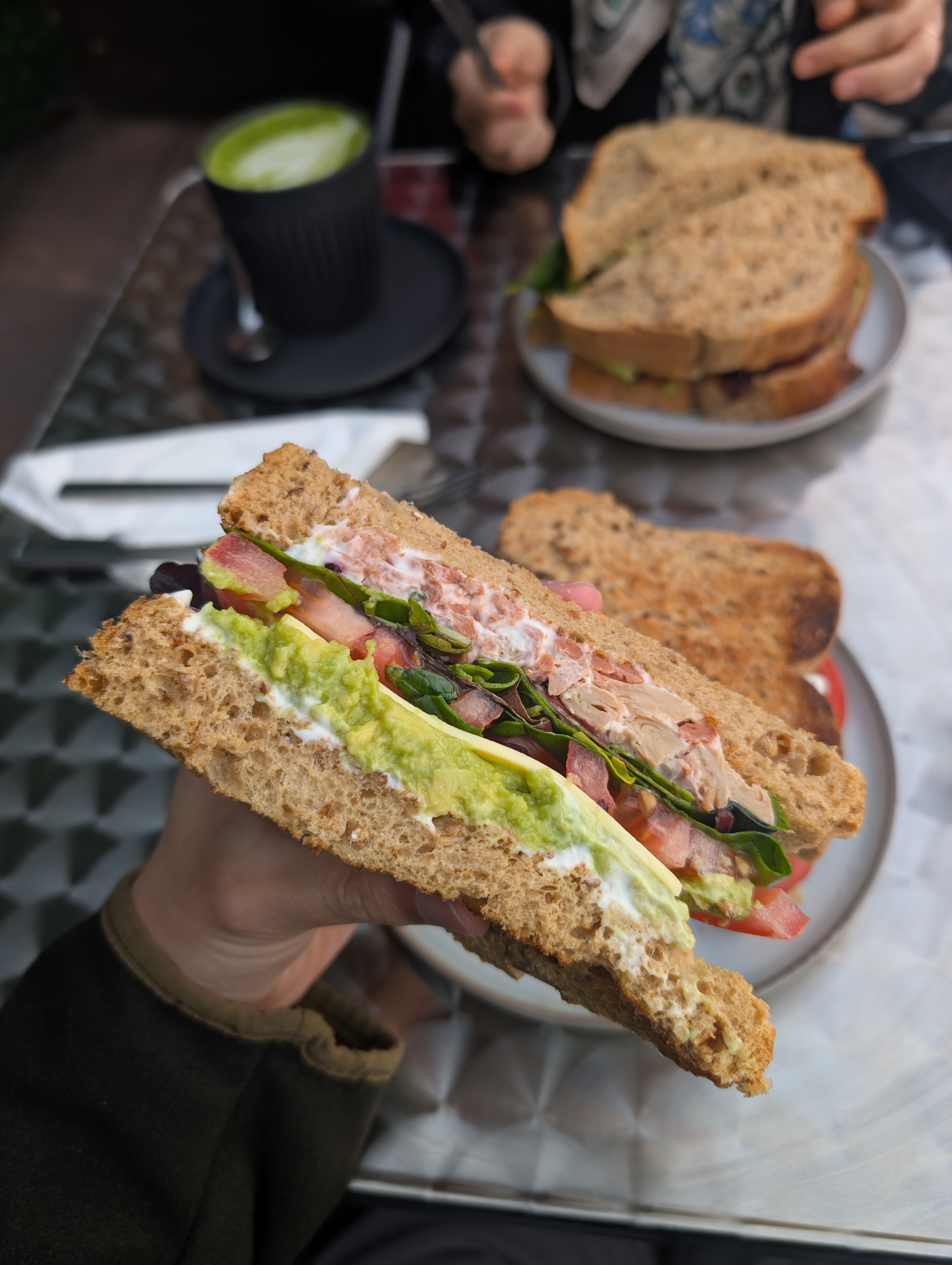 Toasted club sandwich cut into triangles