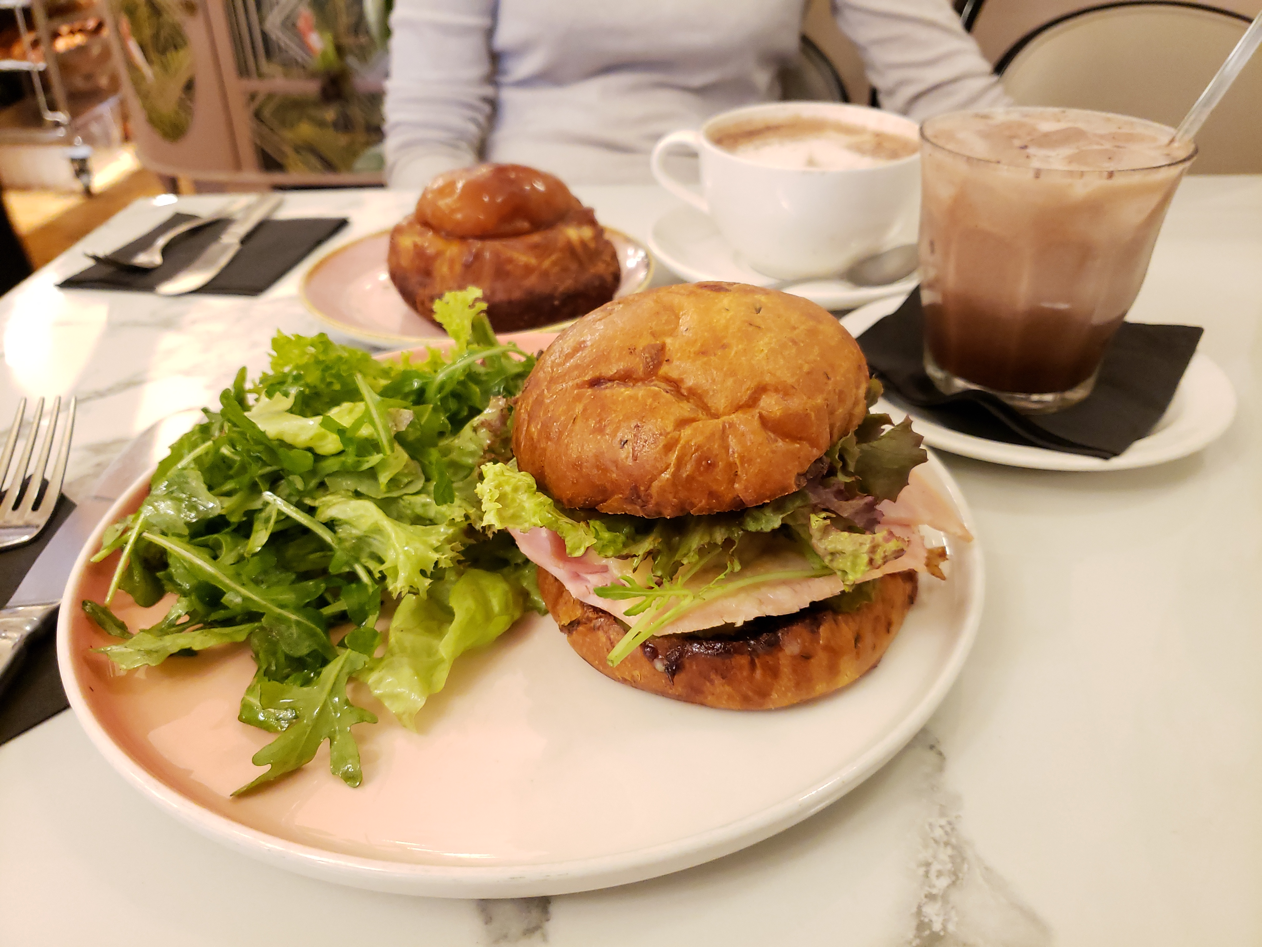 Layered sandwich served on a bun